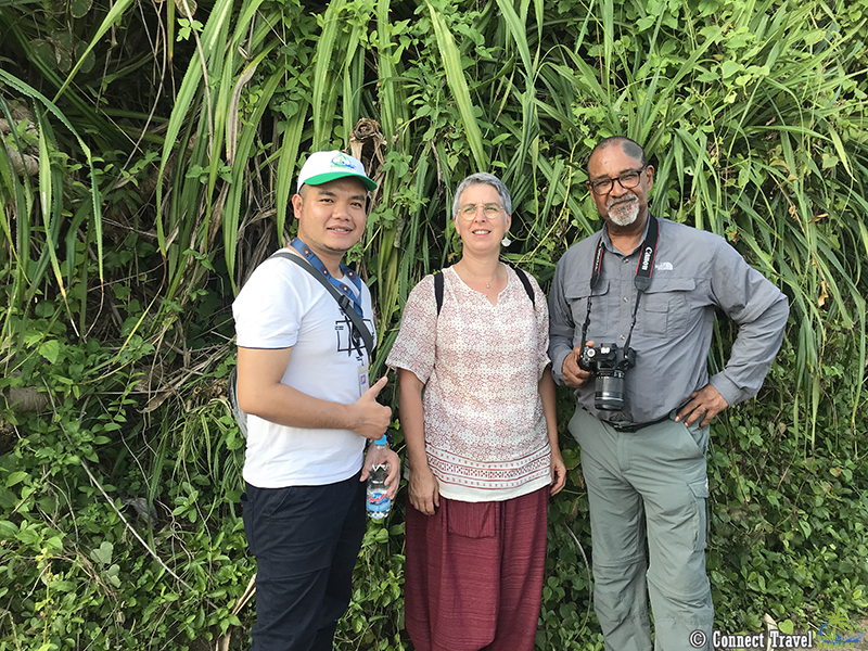 Guide taking picture with tourists at Vinh Moc Tunnel